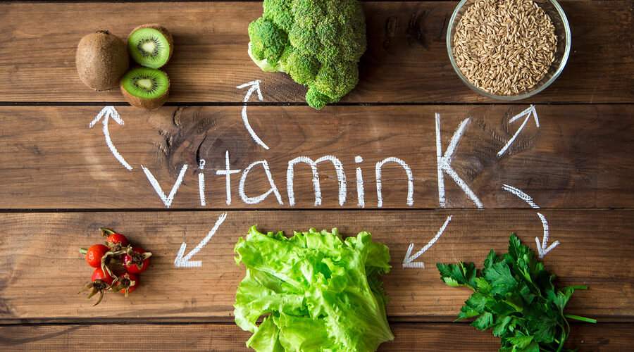 Foods highest in Vitamin K on a wooden board. Healthy eating. Top view